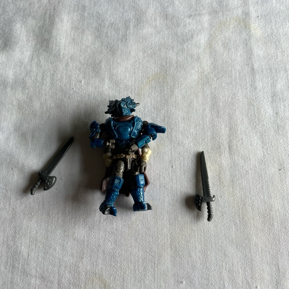Mega Bloks Blue Armored Warrior Action Figure with Two Gray Swords